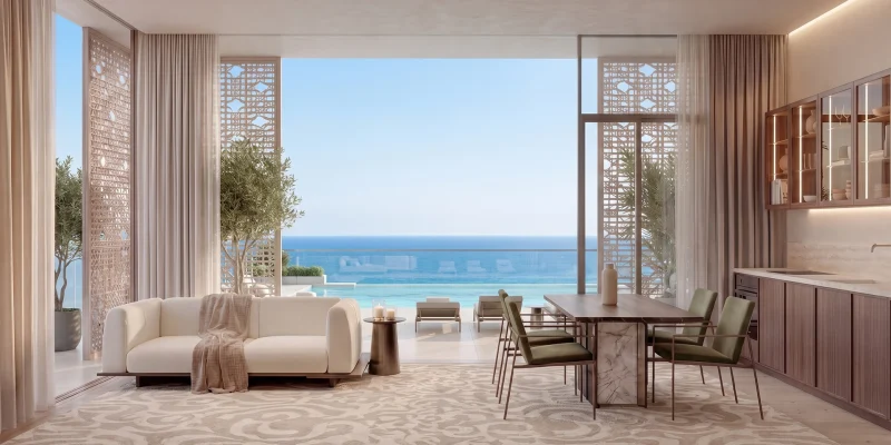 A John Richmond living room at Richmond Residences, the bay beyond the glazing