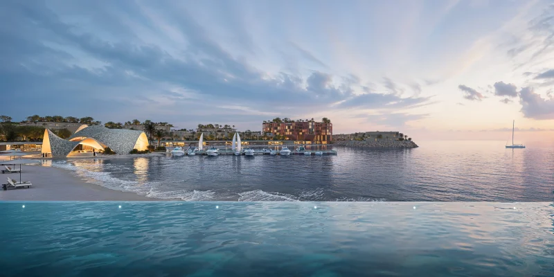 A furnished living and dining space overlooking the sea