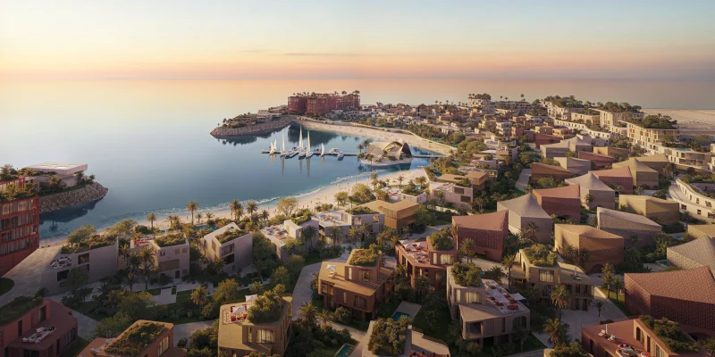 Aerial view of Mira Coral Bay at dusk, its clusters following the Al Mairid shoreline