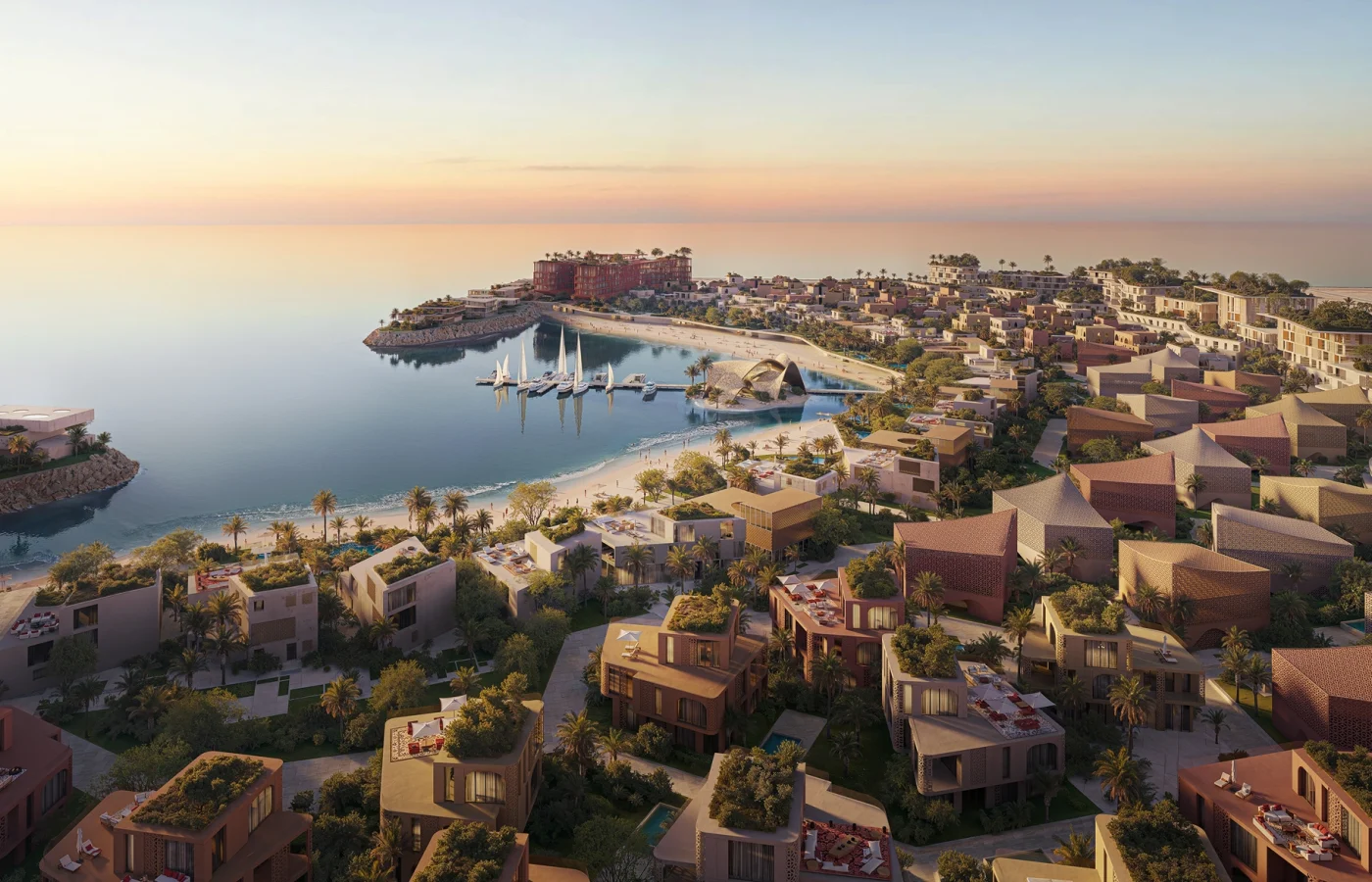 Aerial view of Mira Coral Bay at dusk, its clusters following the Al Mairid shoreline